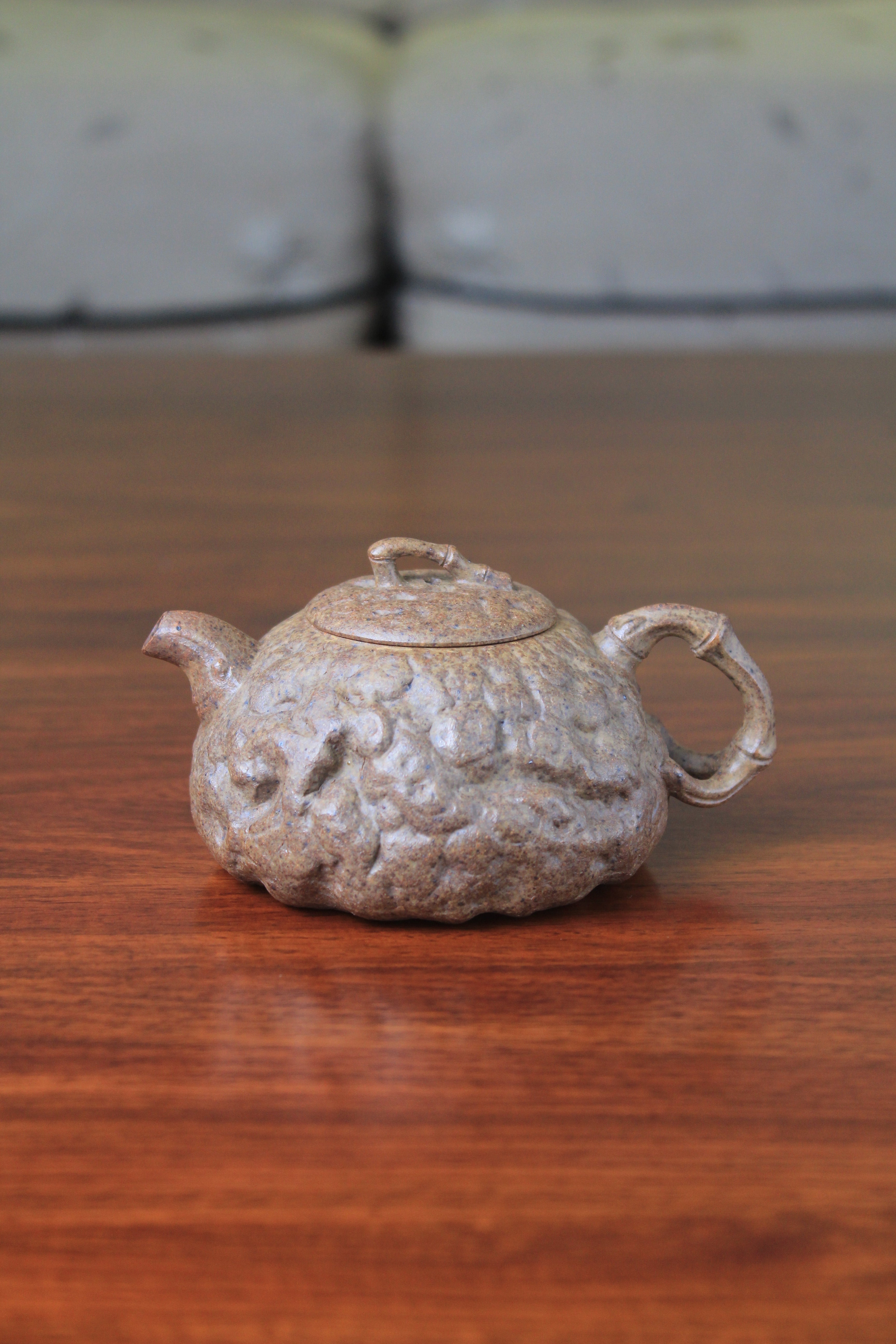yixing teapot gong chun fully handmade with purple clay on the table
